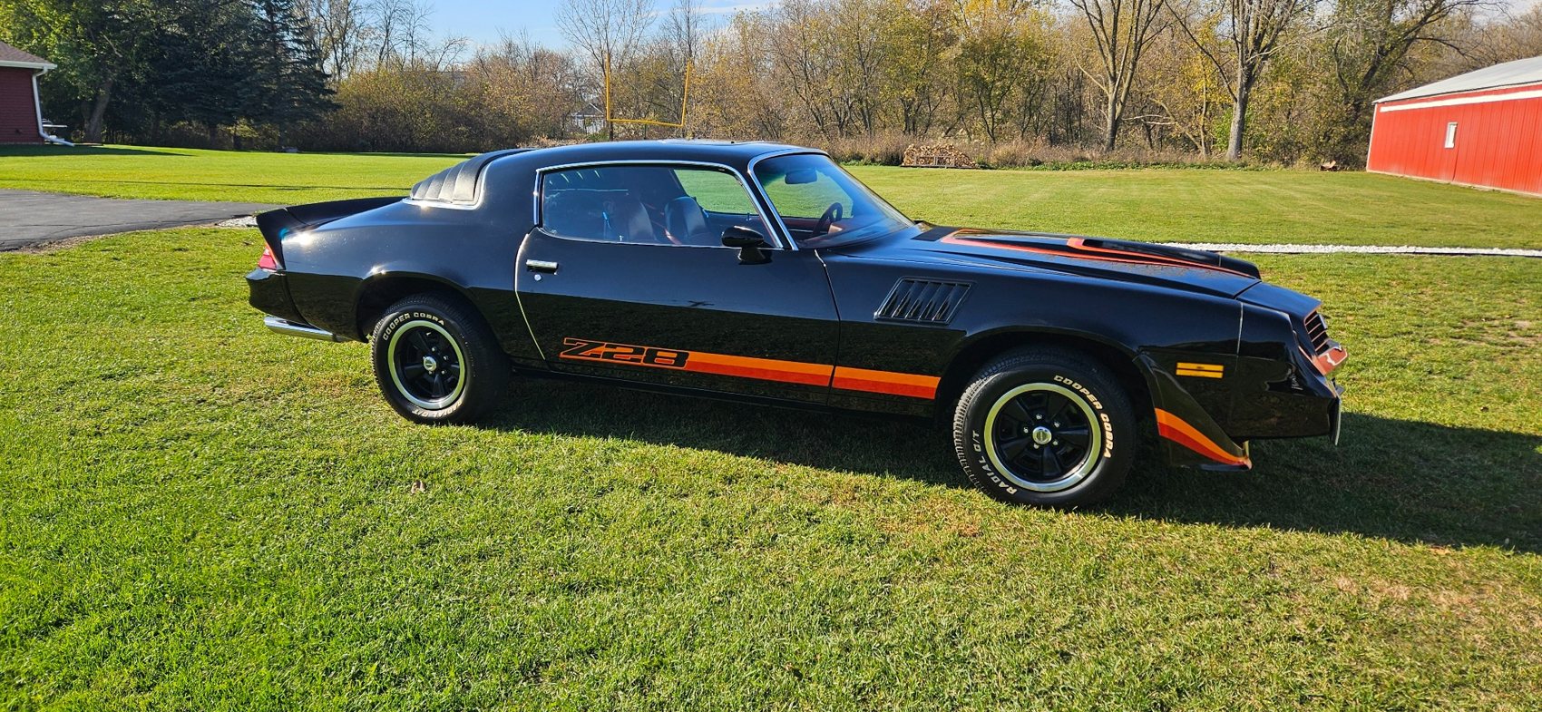Black Chevrolet Camaro Z28 photographed outdoors after detailing